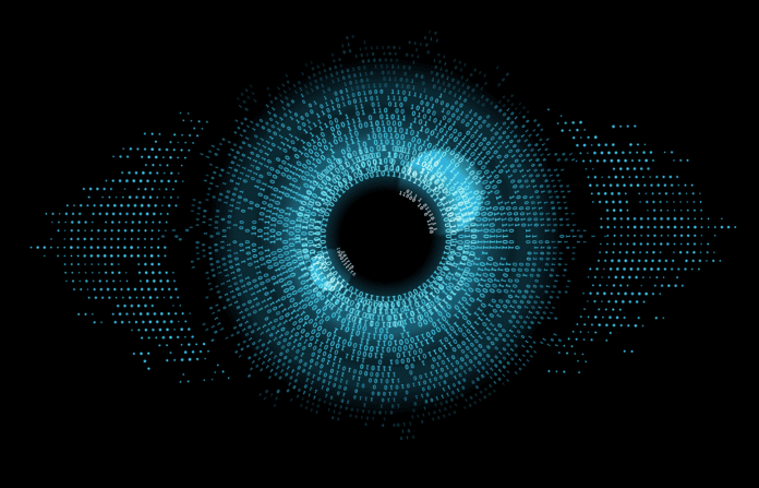 A digital eye with pupils made up of binary values.